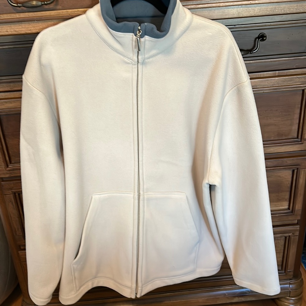 Very nice warm men’s fleece jacket . Beige with a blue green color lining. Large